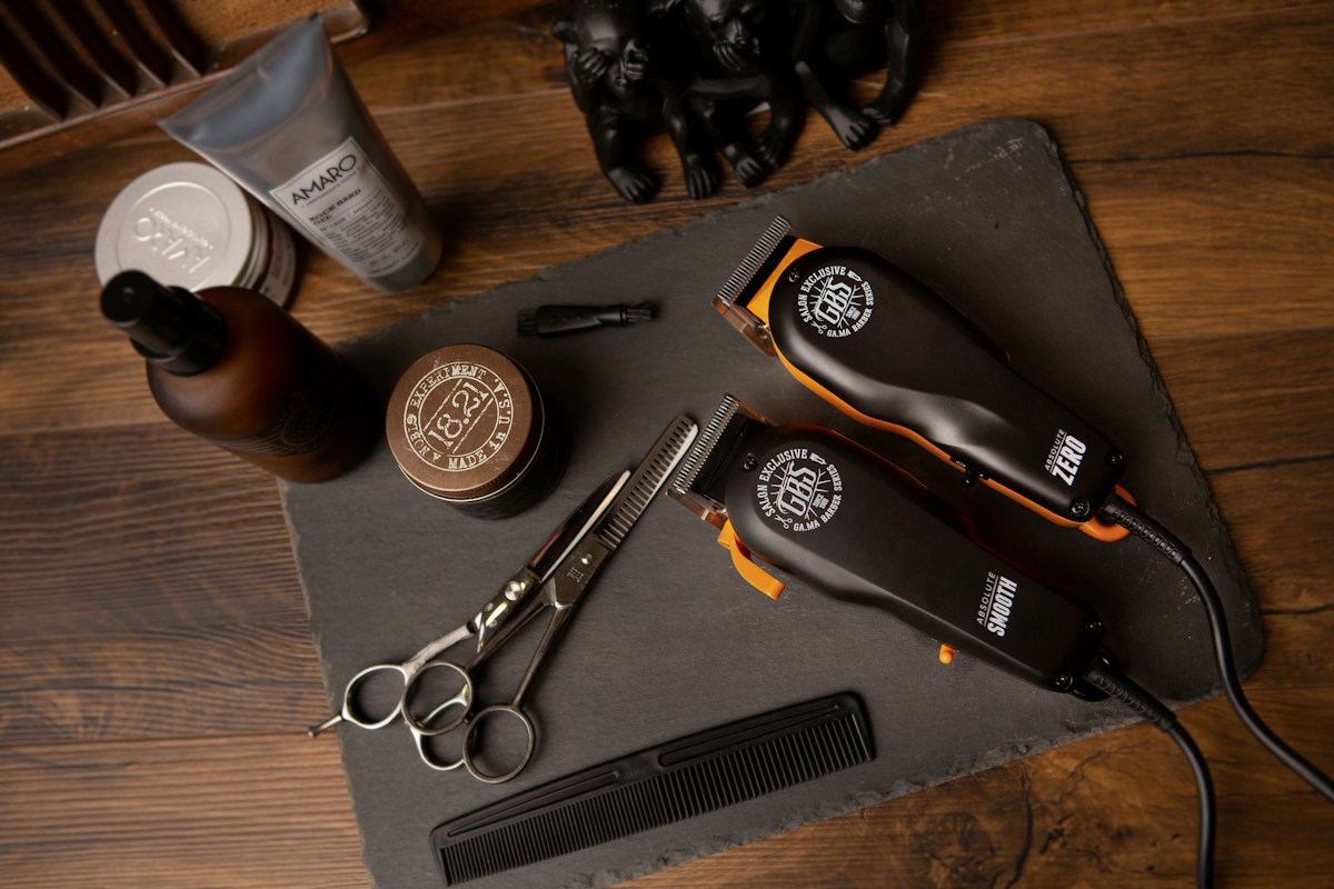 Scissors, combs and clippers on a barber’s worktop